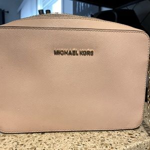 Michael Kors crossbody bag. Light pink with gold hardware.